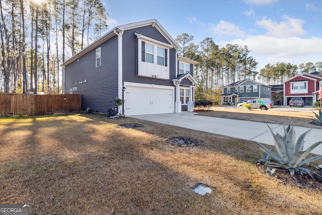 view of side of property with a garage