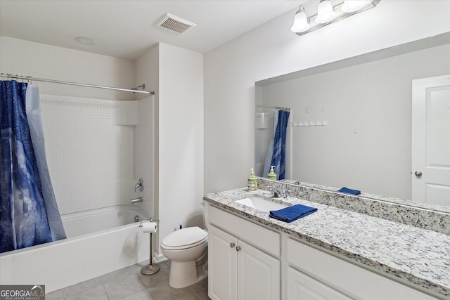 full bathroom featuring tile patterned floors, vanity, shower / bath combination with curtain, and toilet