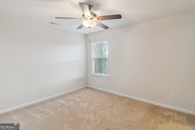 carpeted empty room with ceiling fan