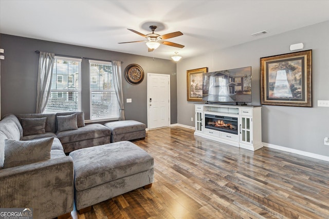 living room with ceiling fan and hardwood / wood-style floors