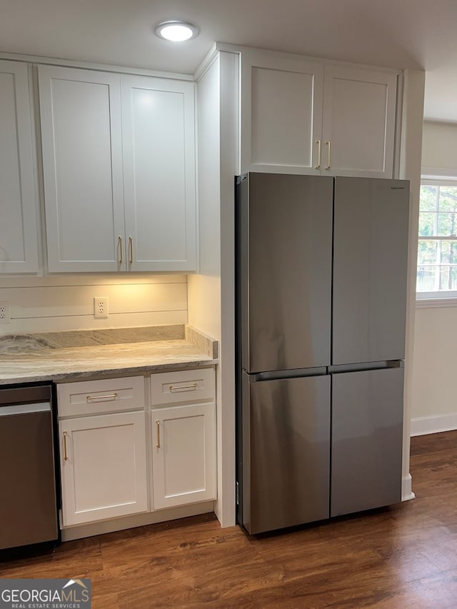 kitchen featuring white cabinets, dark hardwood / wood-style floors, and appliances with stainless steel finishes