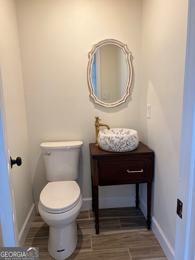 bathroom with sink and toilet