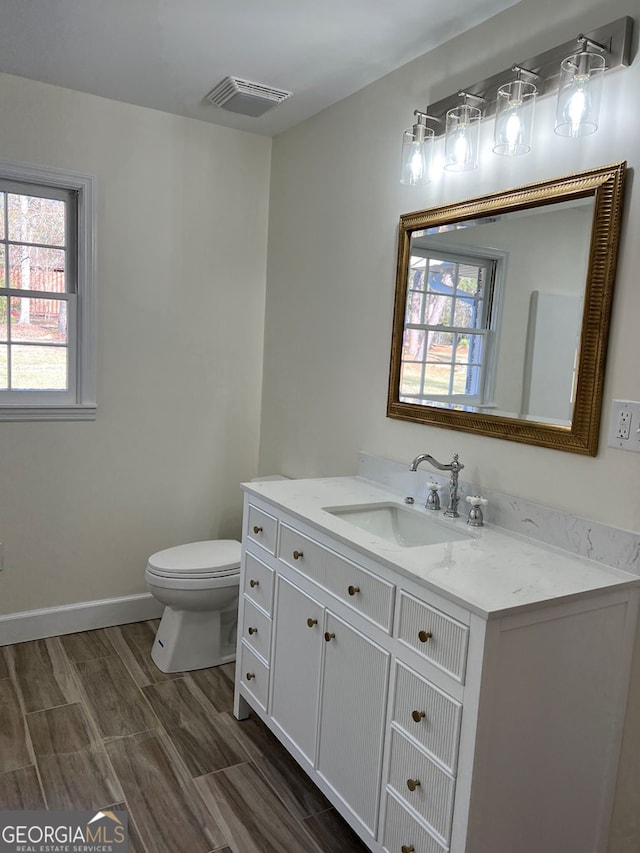 bathroom with vanity and toilet