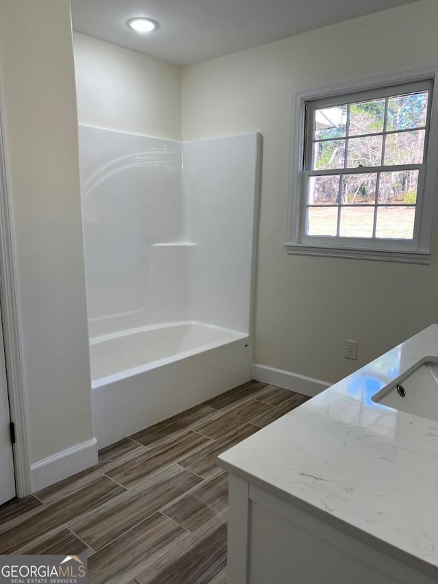 bathroom with vanity and shower / bath combination