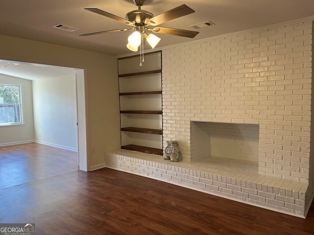 unfurnished living room featuring ceiling fan, a fireplace, and dark wood-type flooring