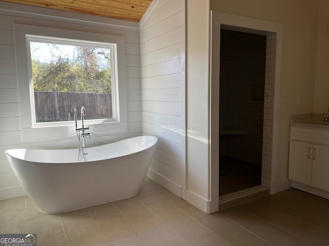 bathroom featuring tile patterned flooring, vaulted ceiling, shower with separate bathtub, vanity, and wood ceiling