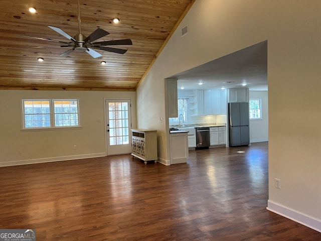 unfurnished living room featuring ceiling fan, dark wood-type flooring, high vaulted ceiling, and wood ceiling