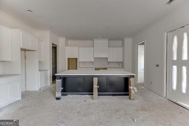 kitchen with white cabinets and a center island