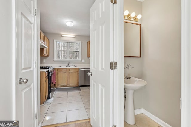 bathroom with tile patterned flooring and sink