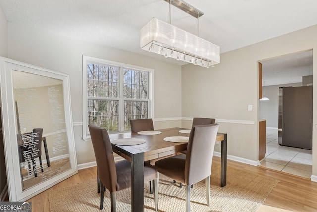 dining space featuring light hardwood / wood-style flooring