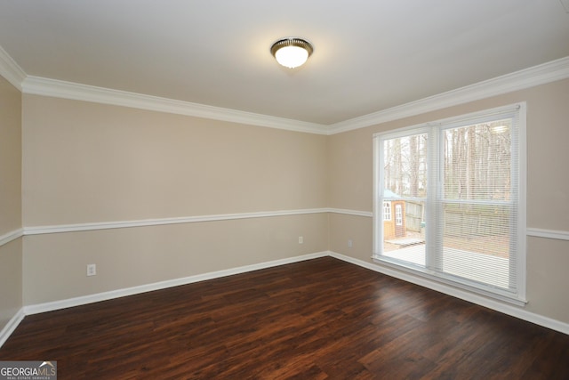 unfurnished room featuring crown molding and dark wood-type flooring