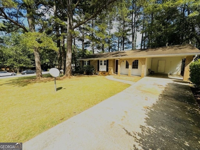 ranch-style home featuring a front yard and a carport