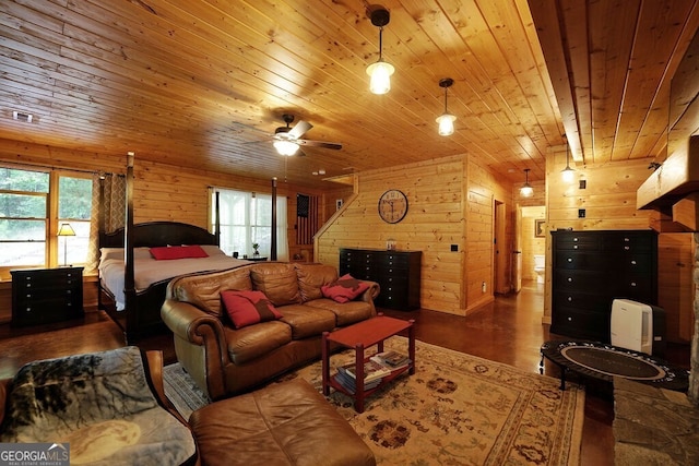 bedroom with wooden walls, wooden ceiling, and dark hardwood / wood-style floors