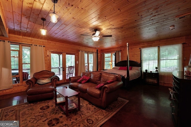 bedroom with access to exterior, wooden ceiling, wooden walls, and multiple windows