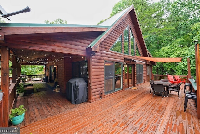 wooden terrace with area for grilling