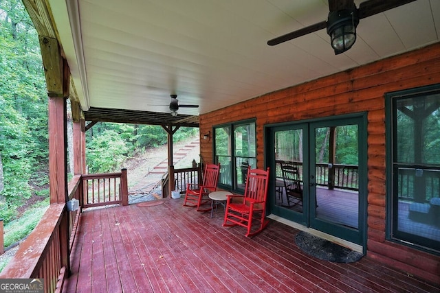 deck with french doors and ceiling fan