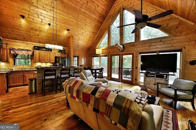 bedroom featuring stainless steel refrigerator with ice dispenser, hardwood / wood-style flooring, high vaulted ceiling, and wooden ceiling