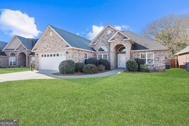 view of front of property featuring central AC, a garage, and a front lawn