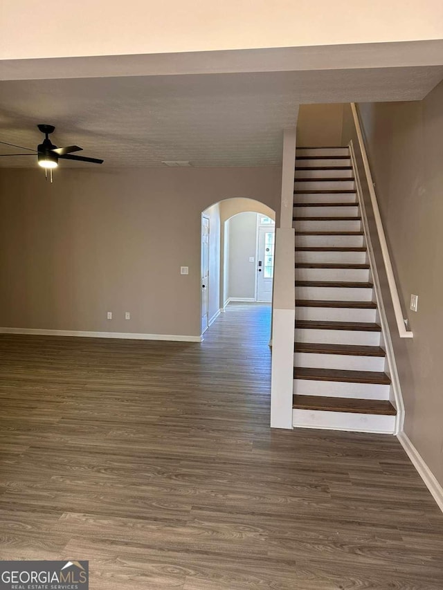 interior space with ceiling fan and wood-type flooring