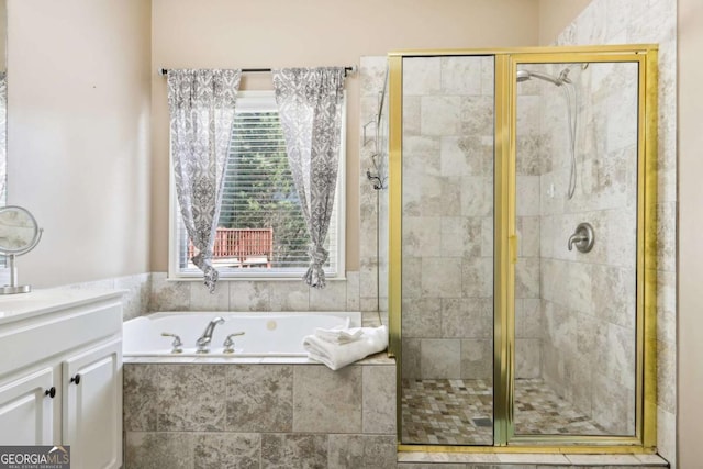 bathroom featuring vanity and separate shower and tub