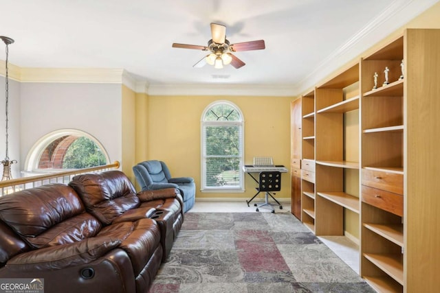 living room with light colored carpet, ceiling fan, and crown molding