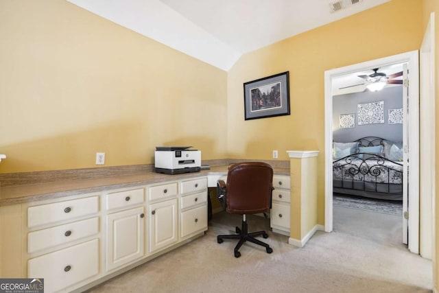 carpeted office featuring vaulted ceiling and ceiling fan