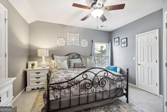 bedroom with light carpet, ceiling fan, and lofted ceiling