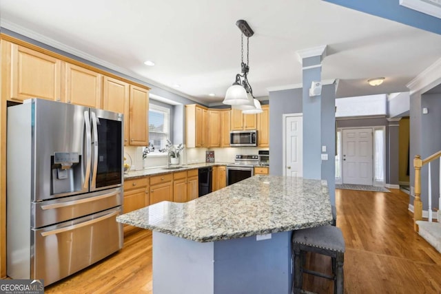 kitchen featuring ornamental molding, stainless steel appliances, and light brown cabinetry