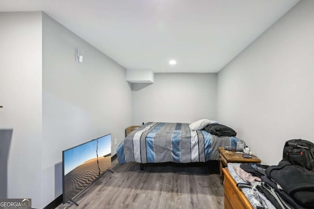 bedroom with wood-type flooring