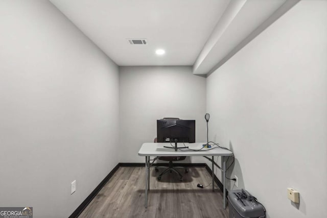 home office featuring hardwood / wood-style floors