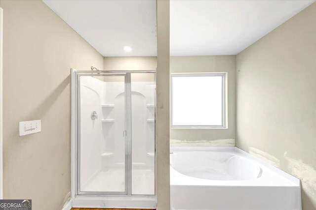 11945 Lovejoy Crossing Way, Hampton, GA 30228 - full bathroom featuring a shower stall and a garden tub