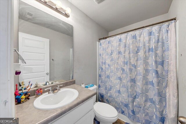 11945 Lovejoy Crossing Way, Hampton, GA 30228 - full bathroom featuring vanity and curtained shower
