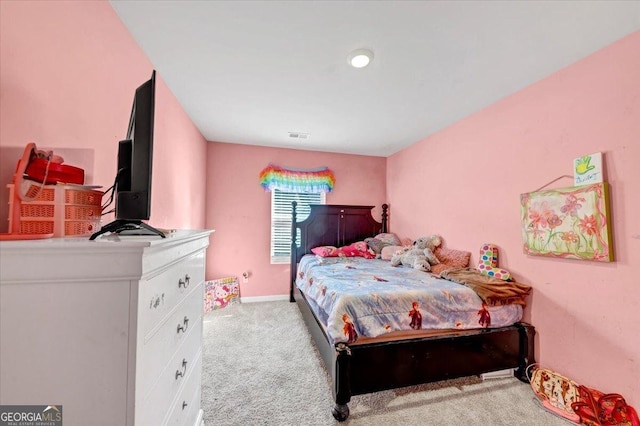 bedroom featuring light colored carpet