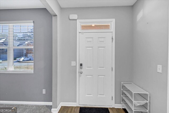 11945 Lovejoy Crossing Way, Hampton, GA 30228 - foyer with baseboards and dark wood finished floors