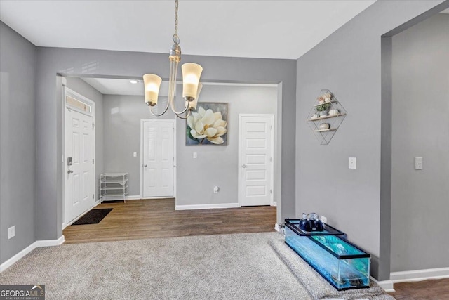 carpeted dining room featuring a notable chandelier