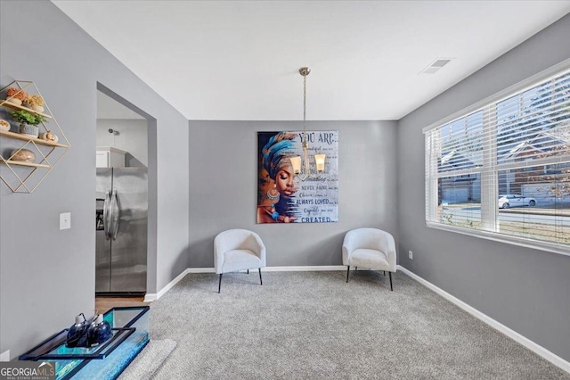 living area featuring carpet floors