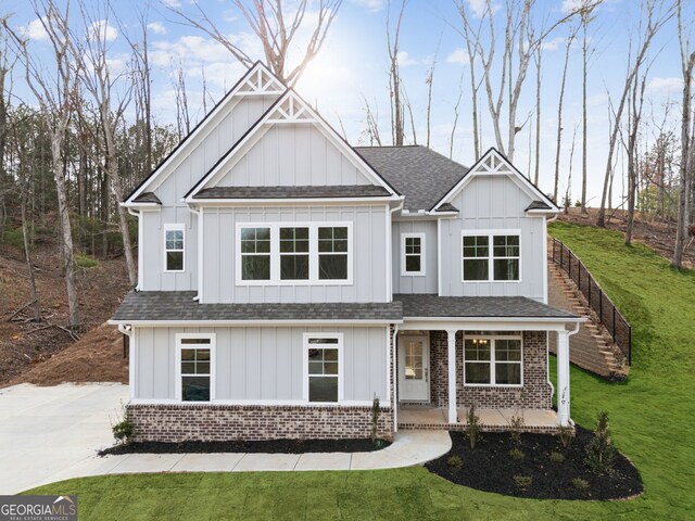 craftsman-style home with a front lawn