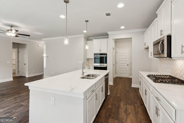 kitchen with white cabinetry, sink, dishwashing machine, decorative backsplash, and crown molding