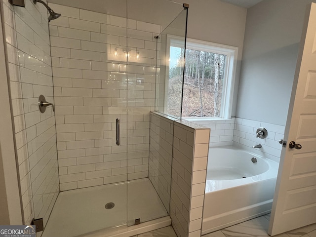 bathroom featuring plus walk in shower