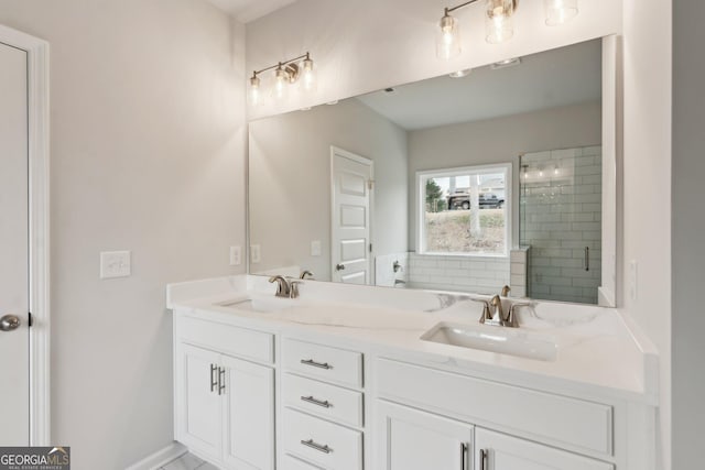 bathroom featuring an enclosed shower and vanity