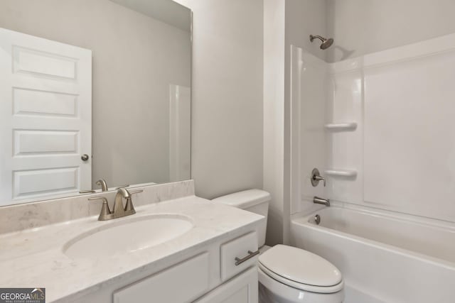 full bathroom featuring vanity, toilet, and washtub / shower combination