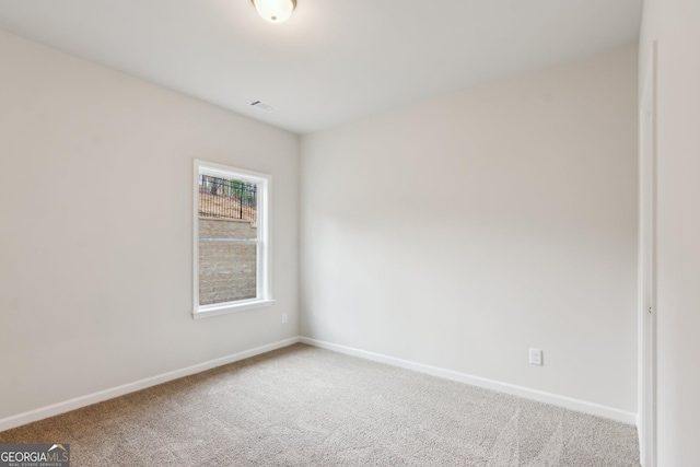 unfurnished room with carpet