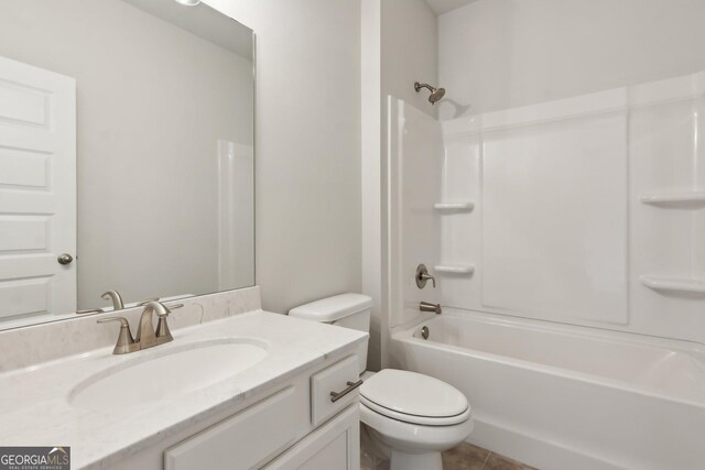 full bathroom featuring shower / bathing tub combination, vanity, tile patterned floors, and toilet