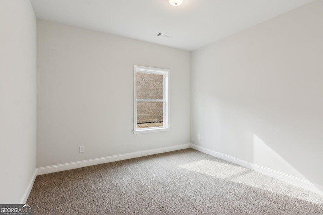 unfurnished room featuring carpet floors