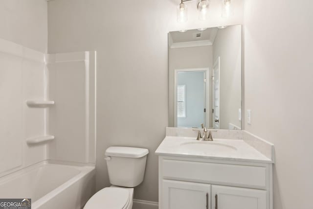 full bathroom with crown molding, washtub / shower combination, vanity, and toilet