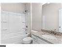 bathroom featuring shower / tub combination and sink