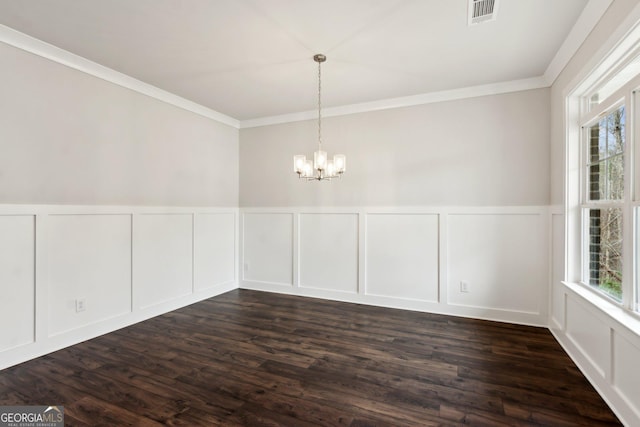 unfurnished dining area with a notable chandelier, dark wood-type flooring, and a healthy amount of sunlight