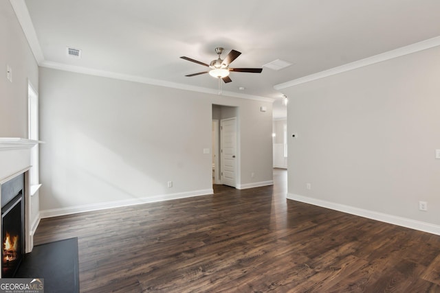 unfurnished living room featuring ceiling fan, ornamental molding, and dark hardwood / wood-style floors