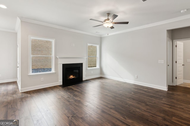 unfurnished living room featuring crown molding, dark wood-type flooring, and ceiling fan