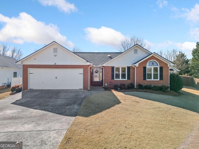 ranch-style home featuring a front lawn and a garage